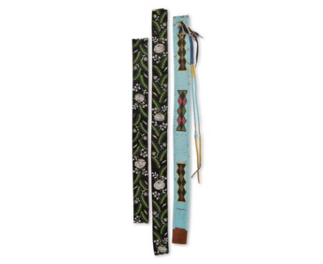 A Plateau beaded belt leather with three geometric designs on a light blue ground, with a tassel having bone discs, 98cm long