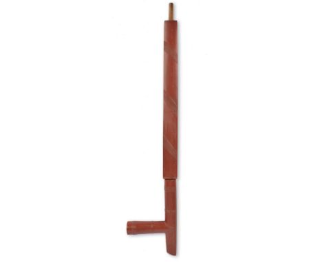 A Plains large pipe catlinite with carved relief ribbed bands, in two parts with wood tubes, 58cm long. (2) Provenance John a