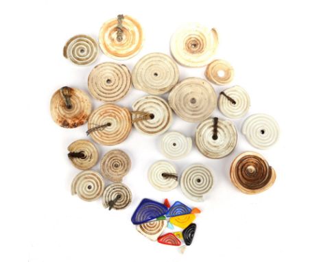 Twenty Ndoro ornaments most collected in Southern Rhodesia including five conus shell and sixteen ceramic, and twelve Czechos