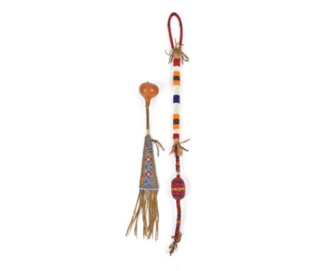 A Southern Plains rattle gourd, wood and beaded hide, circa 1900, 43cm long, and a Plains beaded dance stick / quirt, 74cm lo