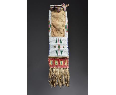 A Lakota pipe bag Plains buckskin, coloured glass beads and dyed quill, with differing geometric designs to each side, the ed