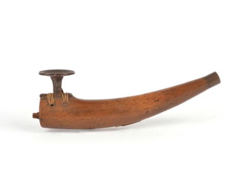 An Inuit pipe Alaska wood, steel, brass with sinew binding, with a detachable plug end, the centre of the underside with a sm