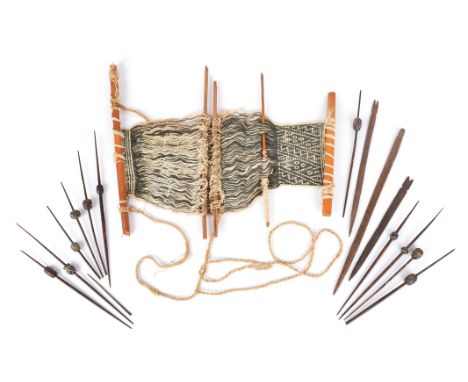 Eleven Peru weaving spindles with incised or painted decoration and with incised beads, the longest 27.5cm, two weaving tools