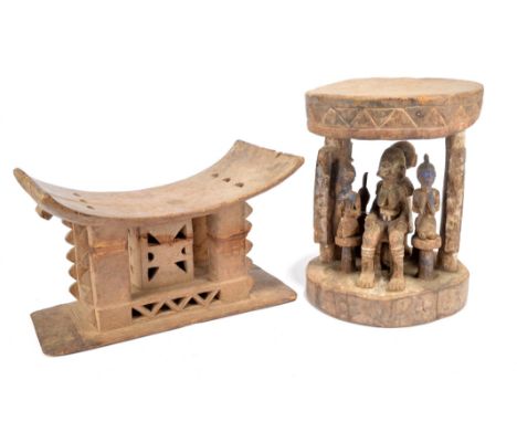 A Yoruba caryatid stool Nigeria with a seated female figure and a male figure behind with his hands on her shoulders, with fo