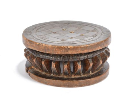 A Lega low circular stool Democratic Republic of the Congo with an incised chequer top with brass tacks on open lozenge suppo