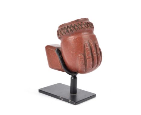 A Sioux pipe bowl Plains catlinite, carved a hand and with a diaper border, the underside inscribed JH, 19th century, 5cm hig