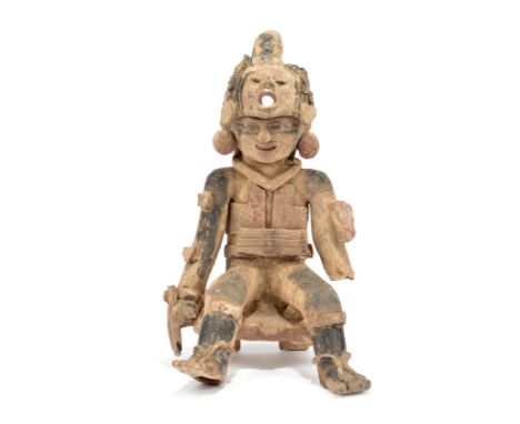 A Veracruz seated warrior Mexico, circa 600 - 900 AD pottery, wearing a mask helmet, a face mask and domed disc earrings, che