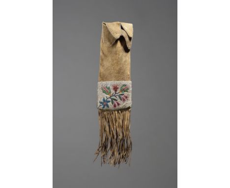 A Chippewa pipe bag Northern Plains hide with two coloured glass beaded floral panels, tassels and beaded edge top, with a ha
