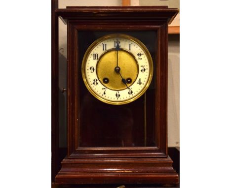 Early 20th Century stained beech cased mantel clock, the gilt dial having an off-white chapter ring with Arabic numerals   Co