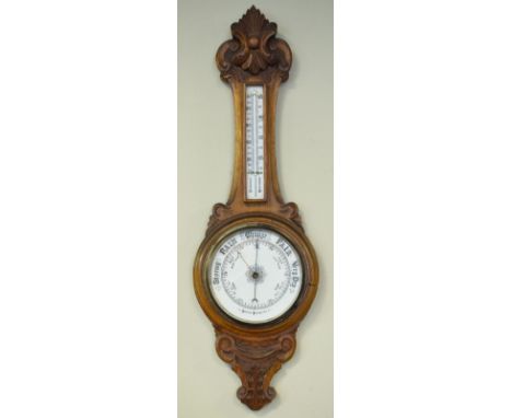 Early 20th Century carved oak cased aneroid barometer and thermometer   Condition: 