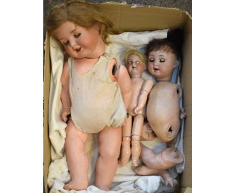 Two Armand Marseille bisque head dolls, together with another German bisque head doll, each having a composition body   Condi