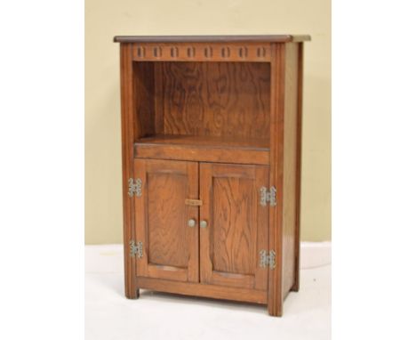 Reproduction oak side cabinet fitted two doors with open shelf above   Condition: 