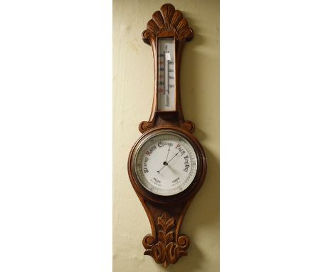 Early 20th Century carved oak cased aneroid barometer and thermometer   Condition: 