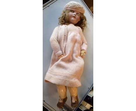Heinrich Handwerck bisque head doll having a jointed composition body   Condition: 