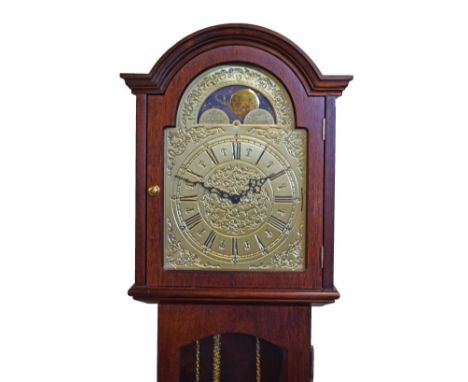 Reproduction longcase clock having brass finish arched dial with striking and chiming movement, in a mahogany case   Conditio