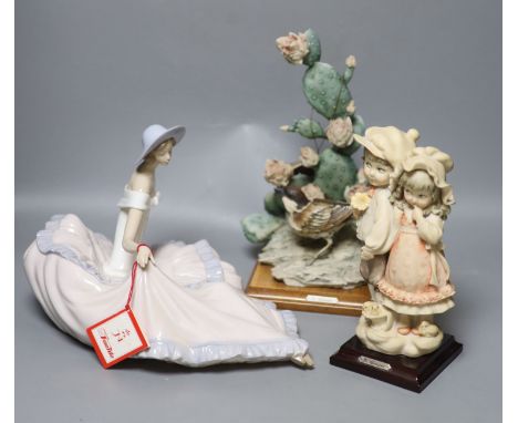 Two G Armani porcelain sculptures and a Nao figure of a lady