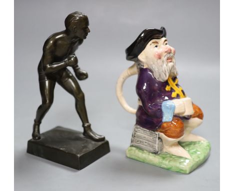 A metal patinated figure of a boxer, height 20cm, and a Melba ware character jug