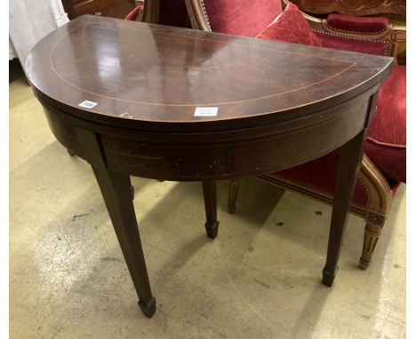 A George III style inlaid mahogany 'D' shaped folding card table, width 92cm, depth 46cm, height 76cm
