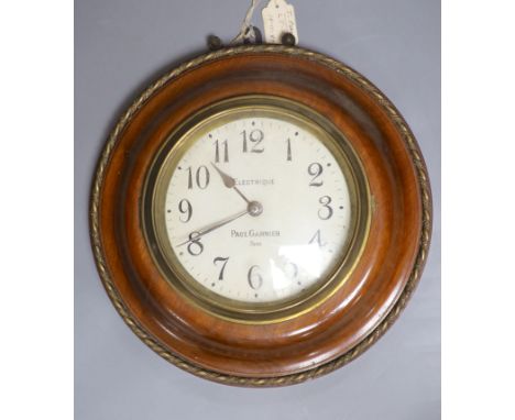 A Paul Garnier electrique mahogany wall slave clock, diameter 29cm