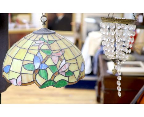 An Edwardian gilt metal and crystal drop bag chandelier and a Tiffany style lamp
