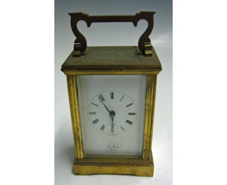 'St James London' Carriage Clock made in England brass, white with black roman numerals, with slight damage to glass on back 