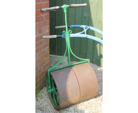 A late 19th century cast iron garden roller, with pierced sides, 127cm H