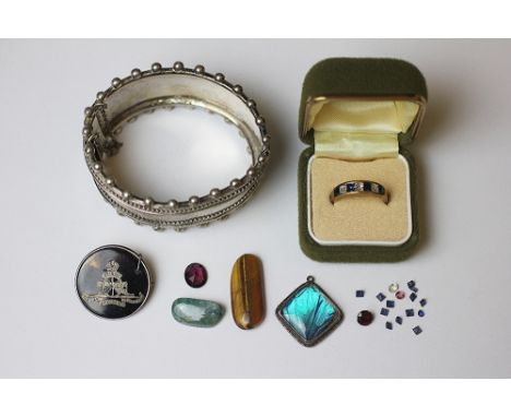 A silver bangle, early 20th century, with beaded detail, stamped 'Sterling Silver' 49gms, along with a Royal Artillary brooch