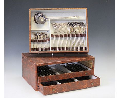 A French silver plated canteen of flatware, circa 1910, possibly Gustave Veyrat, the faux leather case with three drawers com