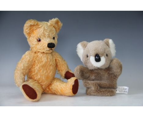 A golden plush teddy bear with articulated limbs, circa 1940's, 40cm long and a Chad Valley koala hand puppet 25cm long (2) 