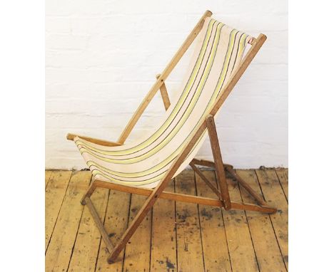 A vintage folding deckchair with striped seat, 125cm high 