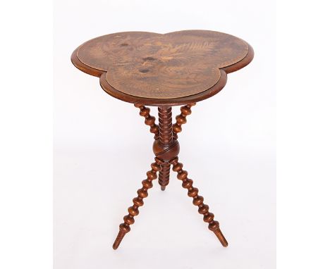 A Victorian walnut occasional table, the trefoil shaped top decorated with ferns, on bobbin turned legs, 66cm H x 56cm W