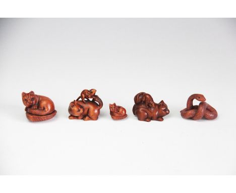 Five assorted netsuke, early 20th century, to include; four cat examples and a snake, each signed (5) 