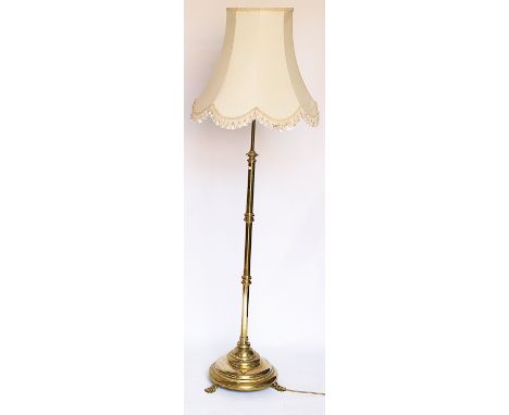 A late Victorian brass adjustable standard lamp, on circular base, 147cm H - Sold as a decorative object only