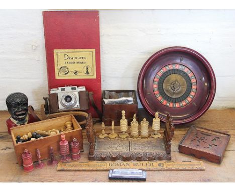 A selection of toys and games, to include a turned bone Barley corn pattern part chess set and a Black Forest carved soft woo