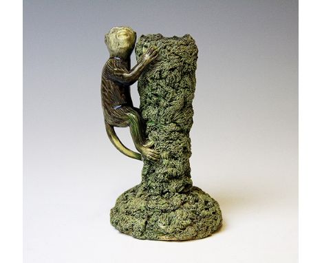 A Palissy type monkey candlestick, Caldas Portugal, designed as a monkey climbing a trunk, impressed mark to base, 15.5cm hig