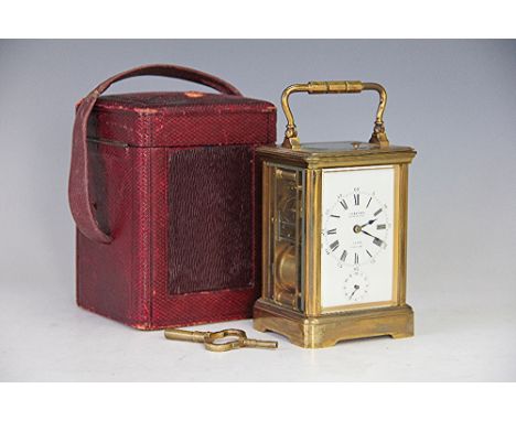 A late 19th century French lacquered brass repeating alarm carriage clock, the enamel face with Roman numeral dial and named 