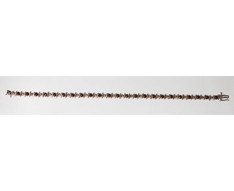 A ruby and diamond line bracelet, designed as alternating rubies and diamonds all set in 9ct gold, weight 6.9gms 
