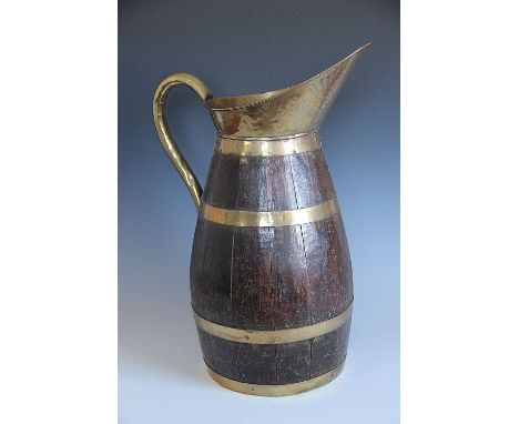 A coopered cider jug or stick stand, with brass bound spout and handle, 59cm high 