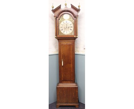 A George III oak eight day longcase clock, with silvered Roman numeral chapter ring with engraved centre with subsidiary seco