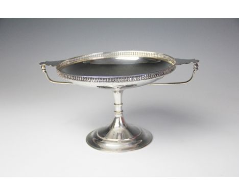A silver tazza, Martin Hall & Co, Sheffield 1916, of circular pedestal form and with galleried rim, 14.5cm high, loaded stem 