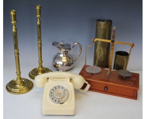 A pair of brass 18th century style candlesticks, a set of Dr Grave Short scales raised on mahogany base with drawer below, a 