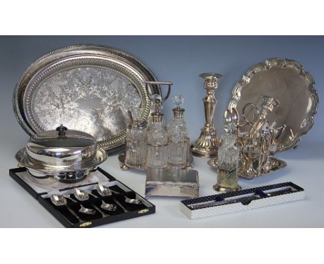 A selection of silver plated items to include a Walker and Hall six bottle cruet with central stirrup shaped handle, a muffin