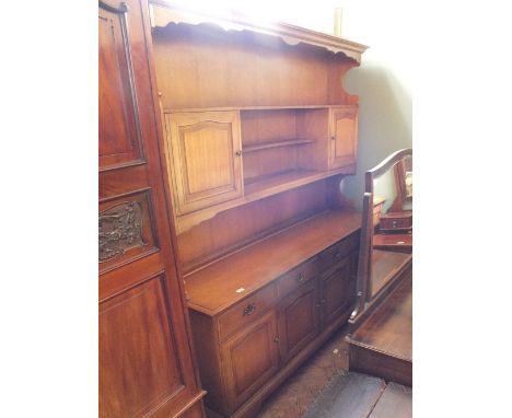 A modern oak shelf back dresser