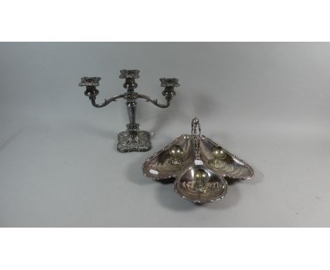 A Collection of Silver Plate to Include Three Branch Candelabra, Three Shell Shaped Salts and a Trefoil Dish 