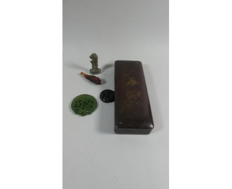 A Lacquered Oriental Box Containing Amulets, Pipe, Scroll Weight etc 