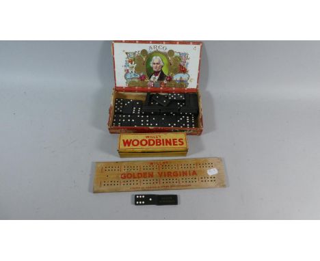 A Tin Set of Wills's Woodbines Dominoes, Golden Virgina Cribbage Board and Cigar Box Containing Dominoes 