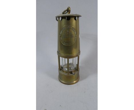 A Brass Miner's Safety Lamp by the Protector Lamp and Lighting Company 