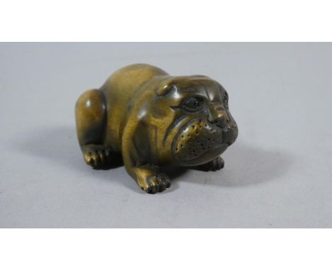 A Carved Wooden Netsuke in the Form of a Bulldog, Signed, 5cm Wide 