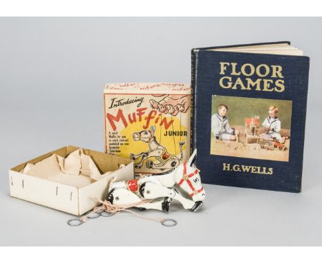 A Moko Muffin the Mule cast metal puppet, in original box —7in. (18cm.) high; and a 1st Edition Floor Games by H.G. Wells 