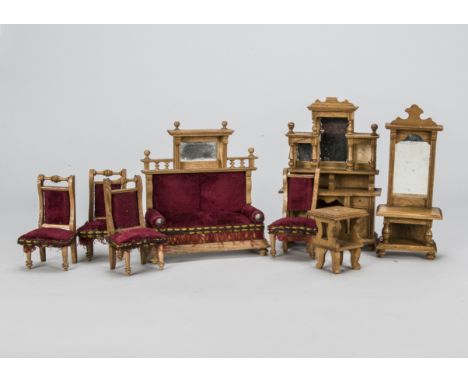 A German oak dolls’ house set, a two seater sofa with mirror above —7in. (18cm.) high, a buffet, a hall mirror, four chairs a